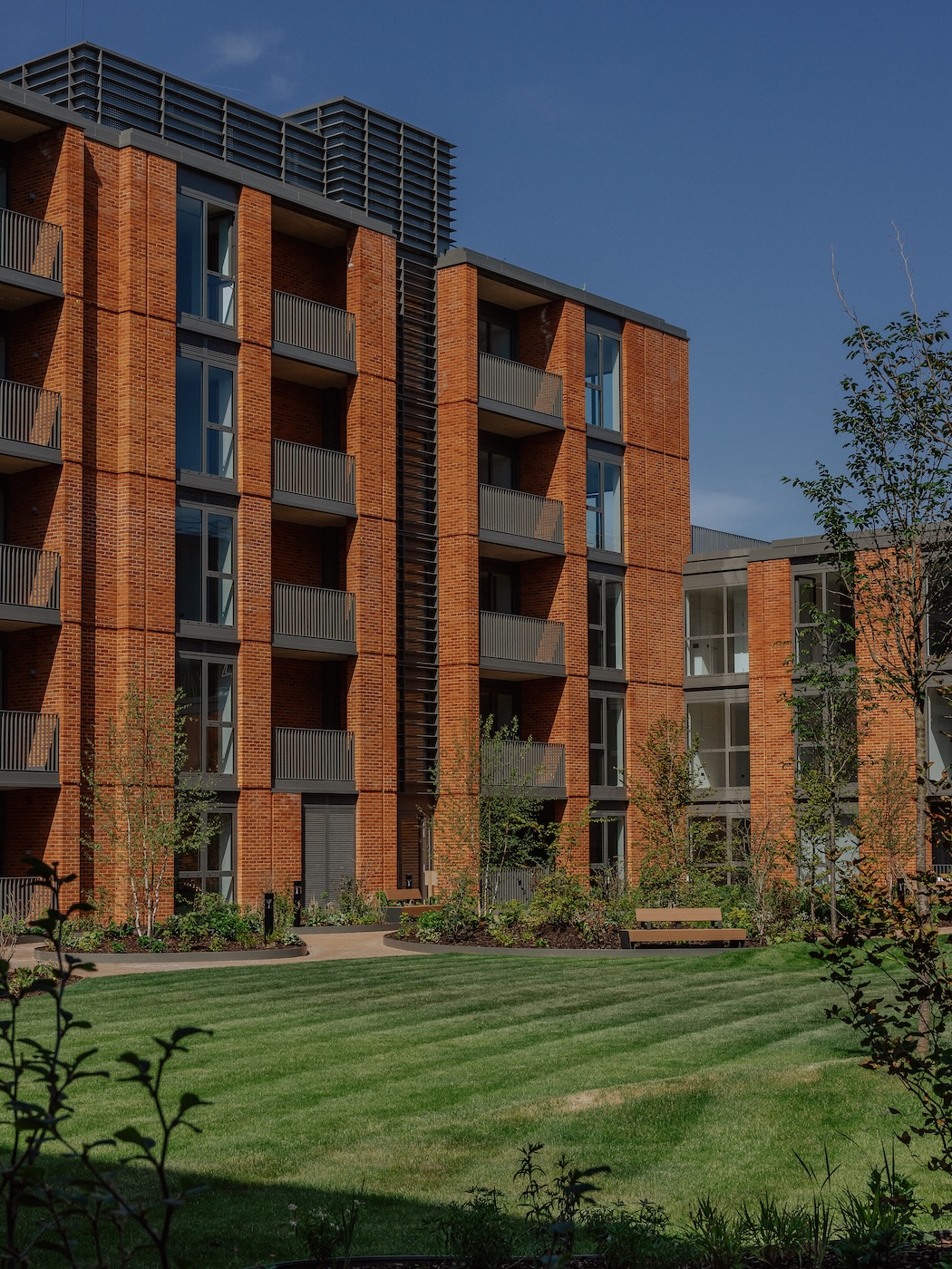 Podium gardens and brick facade